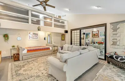a living room with a couch and a bed at The Malibu Retreat Private Compound w/ Salt Water Pool + Views in Malibu