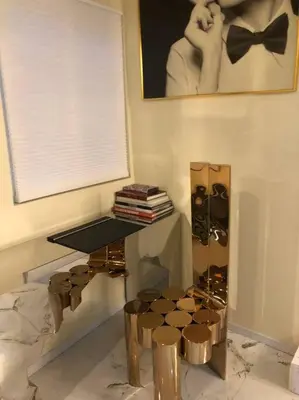a room with a table and a picture of a woman at Stylish Apartment in Koreatown! Central Location!! in Los Angeles