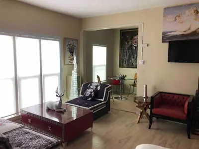 a living room with a couch and a table at Murano Studio in the Heart of Koreatown in Los Angeles