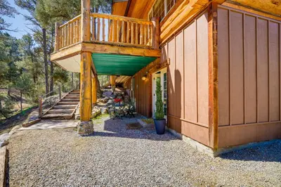 a large deck on the side of a house at Pinon Pines Vacation Rental Hike, Bike and ATV! in Pine Mountain Club