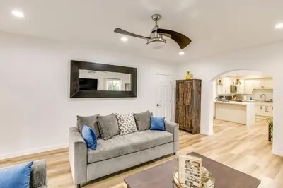 a living room with a couch and a table at 7 Mi to Dtwn! Modern Retreat in East Los Angeles in East Los Angeles