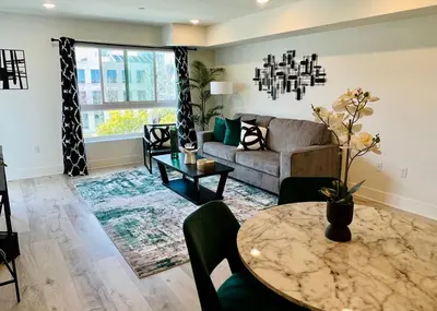 a living room with a couch and a table at Century City Chic 4 sleep free parking 402 in Los Angeles