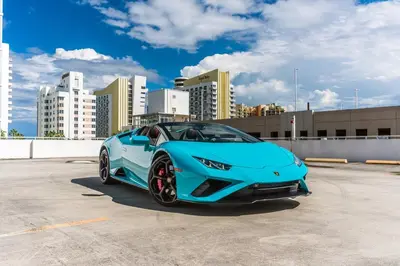 a blue lamborghini parked in a parking lot at Beverly Hills Midle City 1 br Apt with Parking 202 in Los Angeles