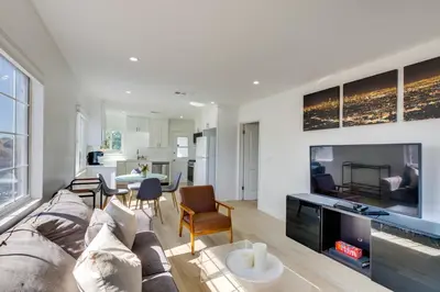 a living room with a couch and a tv at 5 Mi to Venice Beach Chic Los Angeles Abode in Los Angeles