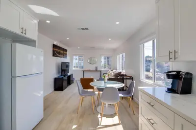 a kitchen and dining room with a table and chairs at 5 Mi to Venice Beach Chic Los Angeles Abode in Los Angeles