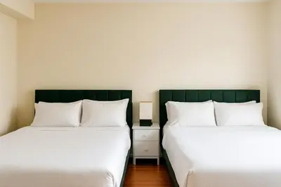 two beds sitting next to each other in a room at Adorable and Bright 2BD 2BR 740 in Los Angeles