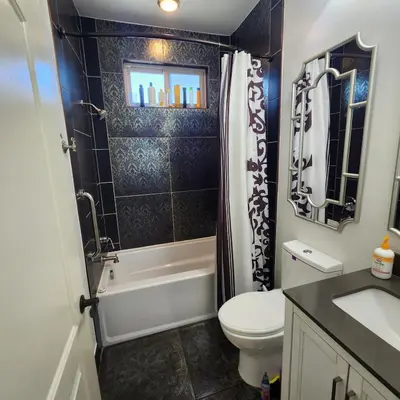 a bathroom with a toilet and a shower and a sink at Luxury 2 bed 1 bath in Torrance