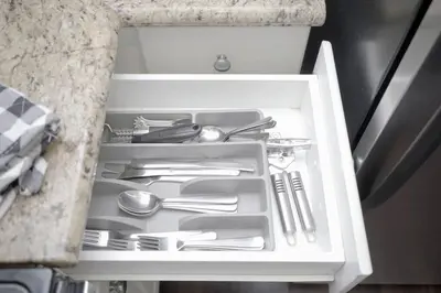 a drawer filled with silver utensils in a kitchen at LBC Cozy Suite -Downtown! Beach! in Long Beach