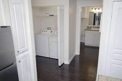 a white kitchen with a sink and a stove at LBC Cozy Suite -Downtown! Beach! in Long Beach