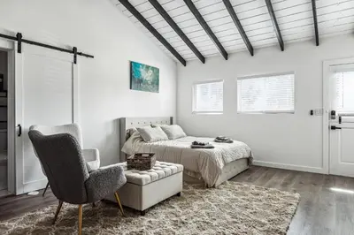 a bedroom with a bed and a couch and a chair at Private Studio Oasis with Nature at Your Doorstep in Thousand Oaks