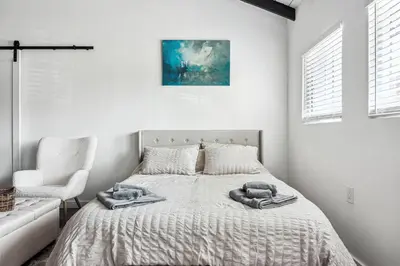 a bedroom with a bed with towels on it at Private Studio Oasis with Nature at Your Doorstep in Thousand Oaks