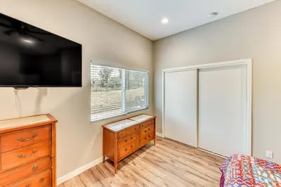 a bedroom with a bed and a dresser and a window at Peaceful Riverside Home with Patio, 7 Mi to Downtown in Riverside