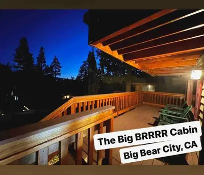 a deck with a wooden railing and a wooden bench at Cozy Cabin near Resorts and The Village +Mtn views in Big Bear City