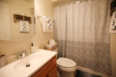 a bathroom with a sink and a toilet and a shower at 5 BR/5 BA Getaway with a View in Thousand Oaks