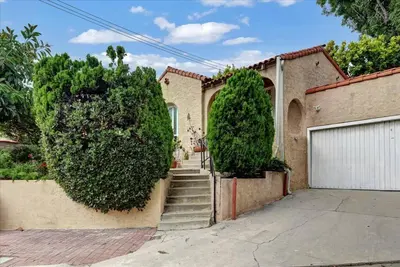 a house with a staircase leading to a garage at Hollywood-Sign Griffith-Observatory & Park Kng Bed in Los Angeles