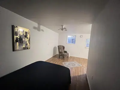a room with a bed and a chair in it at LittleBetty's LandingPad in Torrance