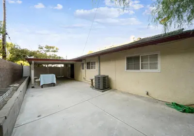 a patio of a house with a white chair at Charming pet friendly family getaway Santa Clarita in Santa Clarita