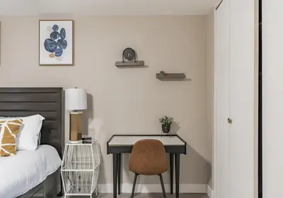 a bedroom with a bed and a desk with a chair at Charming pet friendly family getaway Santa Clarita in Santa Clarita
