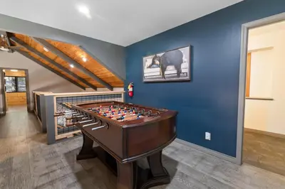 a game room with a foos ball on a table at Evergreen -LUXURY CABIN WITH A HOT TUB, GAME ROOM & 3 EN-SUITE BEDROOMS! in Big Bear Lake