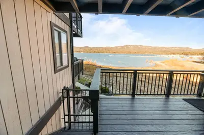 a balcony of a house with a view of a lake at Lakehouse Retreat - Community Pool, Lake Views and Walk to Village! in Big Bear Lake