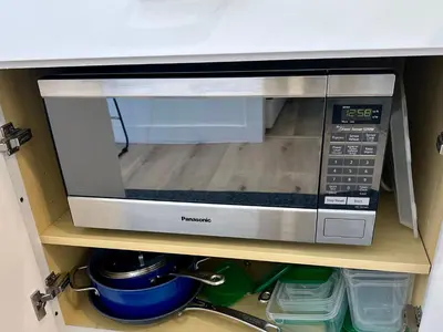 a microwave oven sitting on a shelf in a kitchen at Modern, Remodeled Echo Park House-Walk to Sunset Blvd, Dodgers Stadium, Shops, Bars, Restaurants, Lake, Concerts in Los Angeles