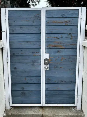 a blue garage door with a silver door knob at Modern, Remodeled Echo Park House-Walk to Sunset Blvd, Dodgers Stadium, Shops, Bars, Restaurants, Lake, Concerts in Los Angeles