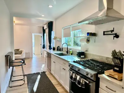 a kitchen with a stove and a sink at Modern, Remodeled Echo Park House-Walk to Sunset Blvd, Dodgers Stadium, Shops, Bars, Restaurants, Lake, Concerts in Los Angeles