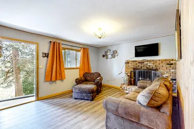 a living room with two couches and a fireplace at Idyllic Cabin in the Woods Cozy Crestline Retreat in Arrowhead Highlands