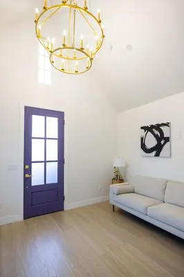 a living room with a couch and a chandelier at Hollywood Family Nest in Burbank, Steps to Studios! in Burbank