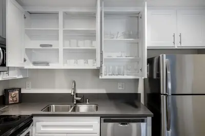 a kitchen with white cabinets and a sink at Hollywood 1BR w pool nr Griffith Park trails LAX-117 in Los Angeles