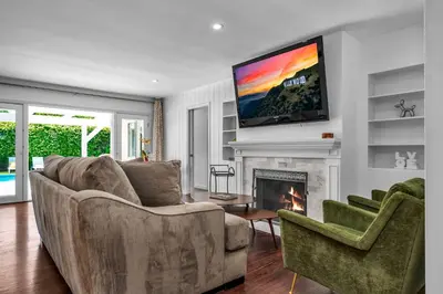 a living room with a couch and a fireplace at Sophia's Oasis in Los Angeles
