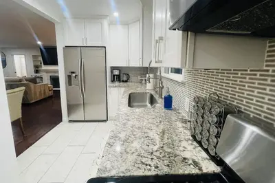 a kitchen with a sink and a refrigerator at Sophia's Oasis in Los Angeles
