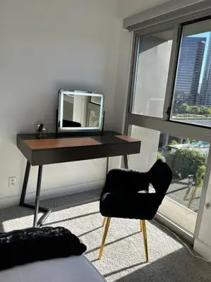 a desk with a mirror and a chair in a room at Downtown LA - Mamba Suite - Free Indoor Parking! in Los Angeles