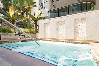 a swimming pool with a hose sticking out of it at 2 bed in Marina Del Rey- Flash holiday deal! in Los Angeles