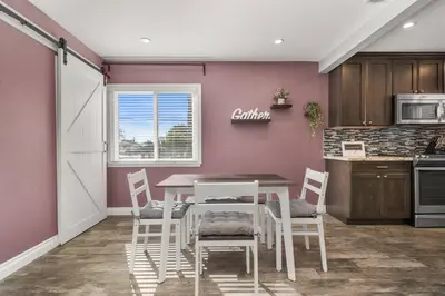 a dining room with a table and chairs in a kitchen at Newly Remodeled Home in the Heart of Orange County in Midway City