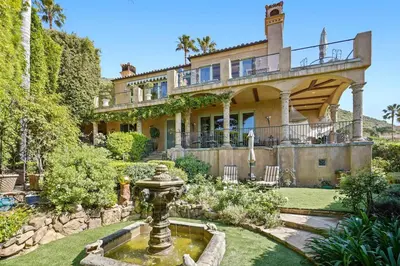 a large house with a fountain in the yard at Malibu by the Sea - 5-STARS! in Solromar