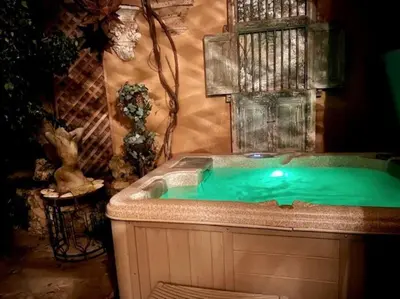 a bath tub with green water in a room at Malibu by the Sea - 5-STARS! in Solromar