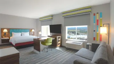a hotel room with a bed and a desk at Hampton Inn By Hilton Santa Clarita-Valencia in Santa Clarita