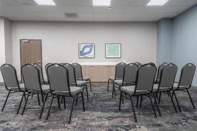 a row of chairs in a room with a wall at Hampton Inn By Hilton Santa Clarita-Valencia in Santa Clarita
