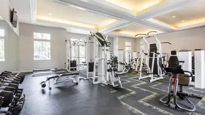 a fitness room with treadmills and tread machines at Canyon Country Cozy Apartment, Pool and Jacuzzi in Santa Clarita