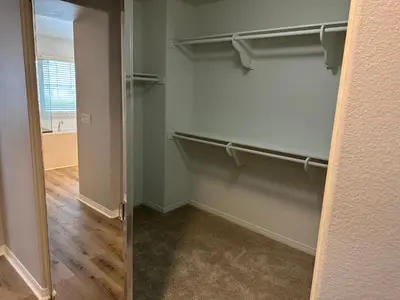 a room with a walk in closet with a door at ALE Displaced, Relocation, Insurance, Fire, Flood in Corona