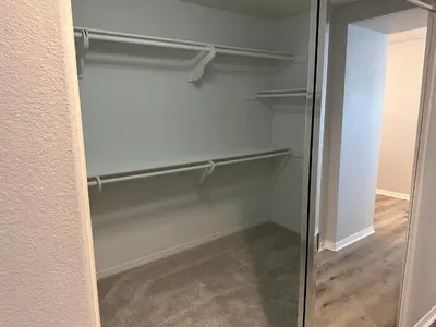 a walk in closet with a glass door at ALE Displaced, Relocation, Insurance, Fire, Flood in Corona