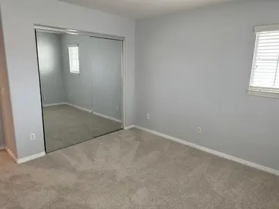 an empty room with a mirror in it at ALE Displaced, Relocation, Insurance, Fire, Flood in Corona
