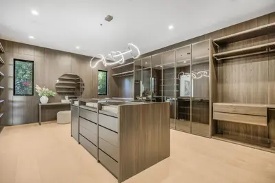 a kitchen with wood paneled walls and a kitchen island at Levitt Lane in Los Angeles