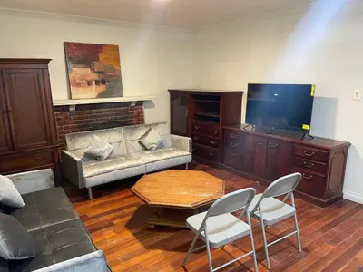 a living room with a couch and a tv at Walking Distance Disney in Anaheim in Anaheim