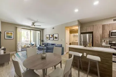 a kitchen and living room with a table and chairs at Woodland Hills Luxury Apt 2 bed CA in Los Angeles