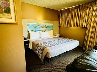 a hotel room with a large bed in it at Hotel Pacific Garden in Gardena