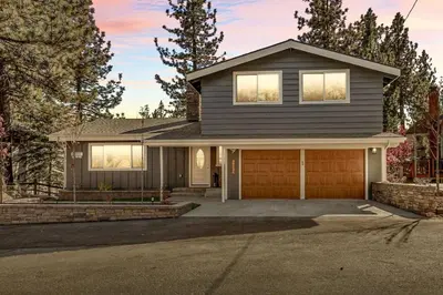 a house with a driveway and a garage at Lakeside Paradise Escape in Big Bear Lake