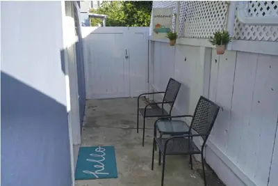 three chairs and a rug on a patio with a fence at 2 Miles to Disneyland -FREE Parking! In Anaheim CA in Anaheim