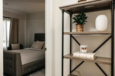 a room with a bedroom with a bed and a shelf at Central Quality 2 BD Apartment in Los Angeles